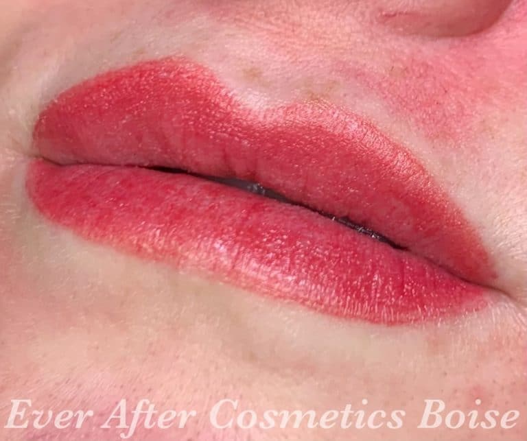Lips with red tattooed lip blush